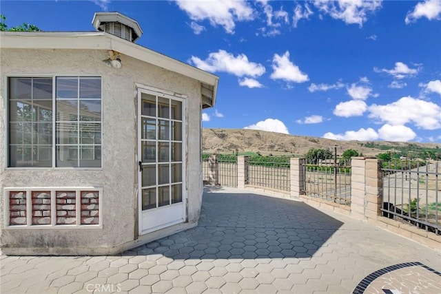 view of patio / terrace with a mountain view