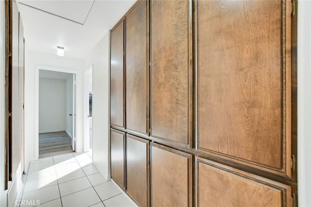 hall with light tile patterned flooring