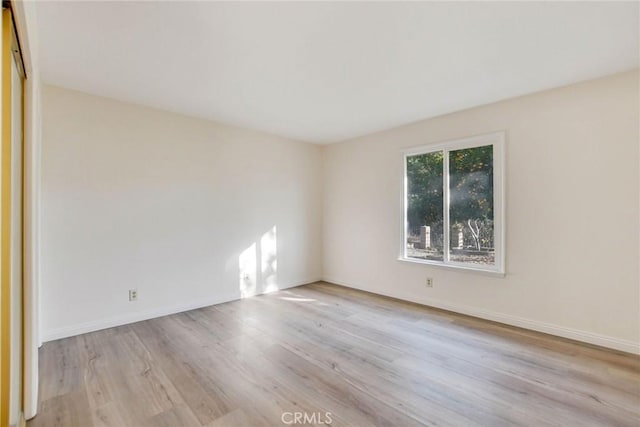 unfurnished room featuring light hardwood / wood-style floors