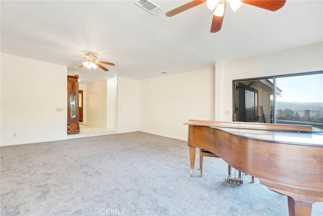 bar featuring carpet floors and ceiling fan