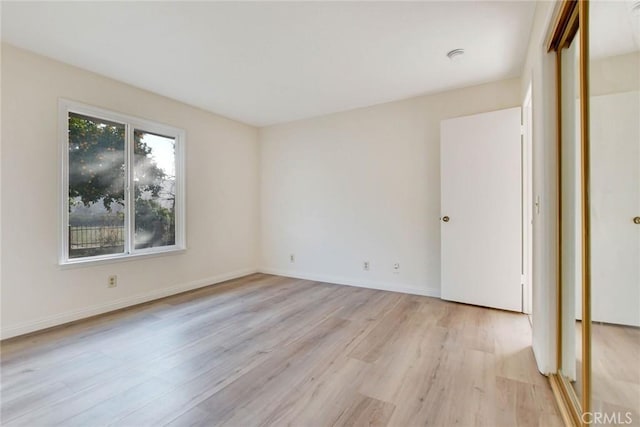 unfurnished bedroom featuring light wood-type flooring