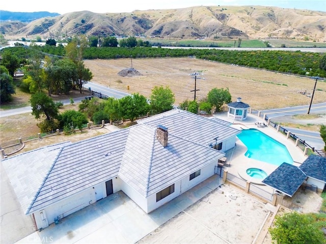 drone / aerial view featuring a mountain view