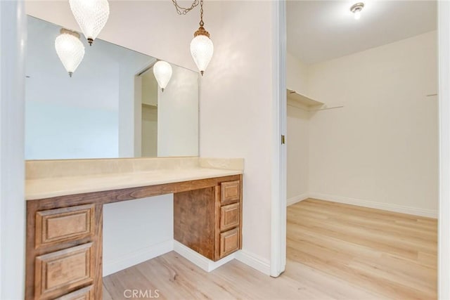 bathroom with wood-type flooring and vanity