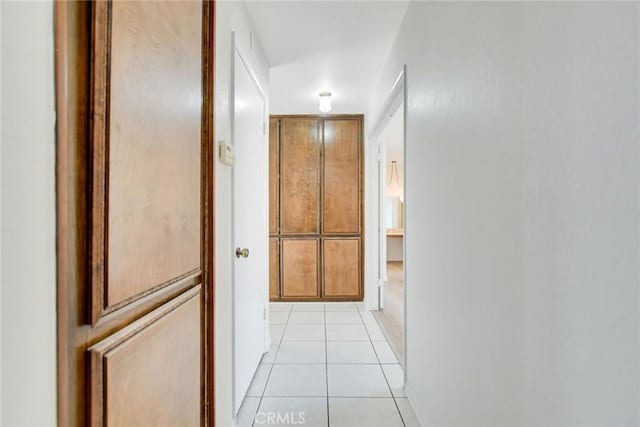 hallway with light tile patterned floors