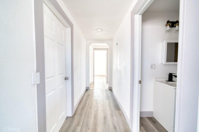 hall with light wood-type flooring