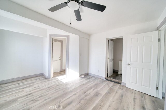 unfurnished bedroom featuring ceiling fan, light hardwood / wood-style flooring, and ensuite bath