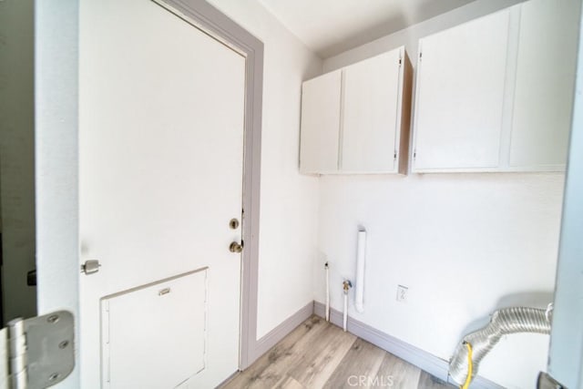 laundry room featuring light hardwood / wood-style floors