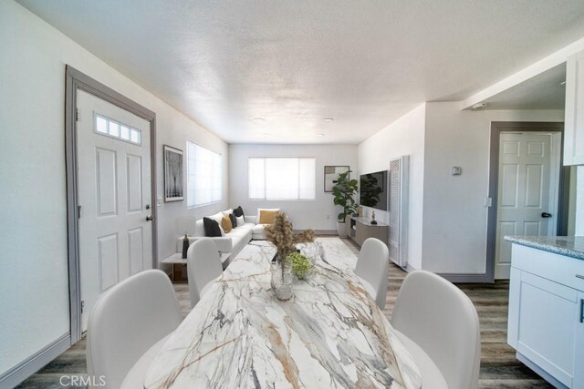 dining room with dark wood-type flooring