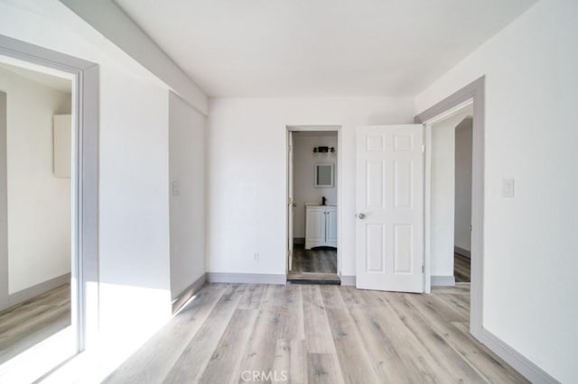 unfurnished room featuring light wood-type flooring