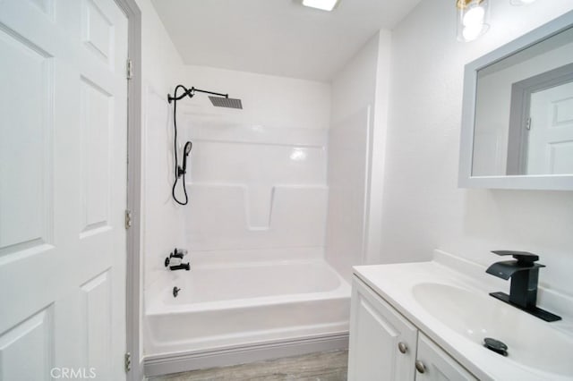 bathroom with vanity and  shower combination