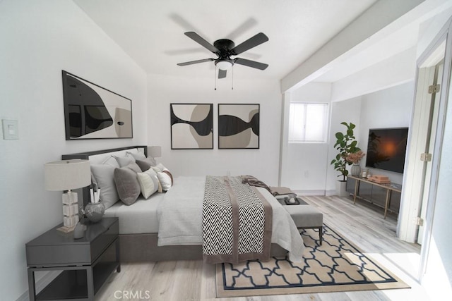 bedroom featuring ceiling fan and light hardwood / wood-style floors