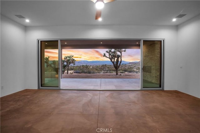 interior space with ceiling fan