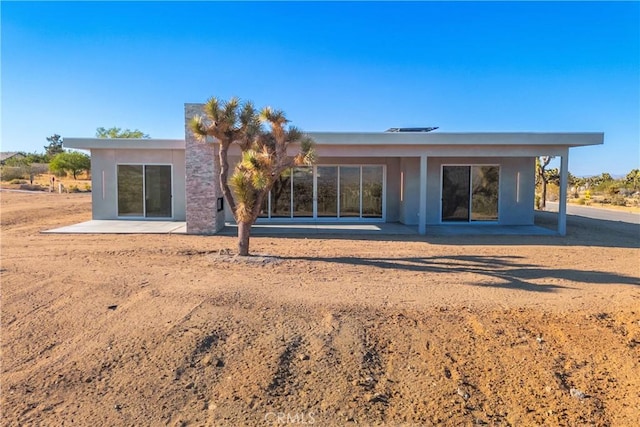 back of house with a patio area