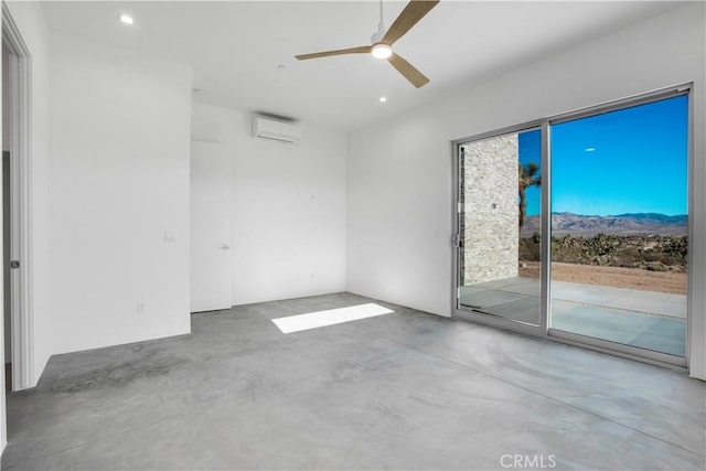 empty room with a wall mounted air conditioner, ceiling fan, and concrete flooring