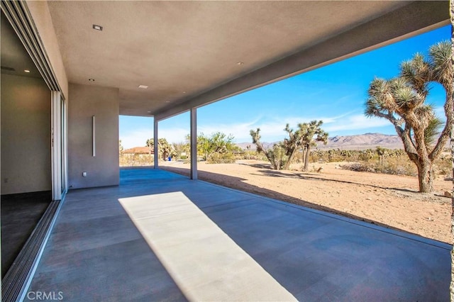 view of patio with a mountain view