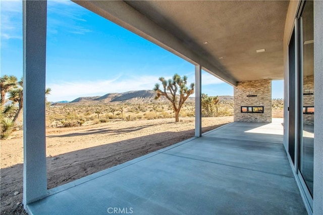 view of patio featuring a mountain view