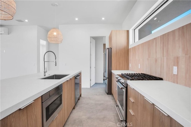 kitchen with decorative light fixtures, sink, stainless steel appliances, and a wall mounted AC