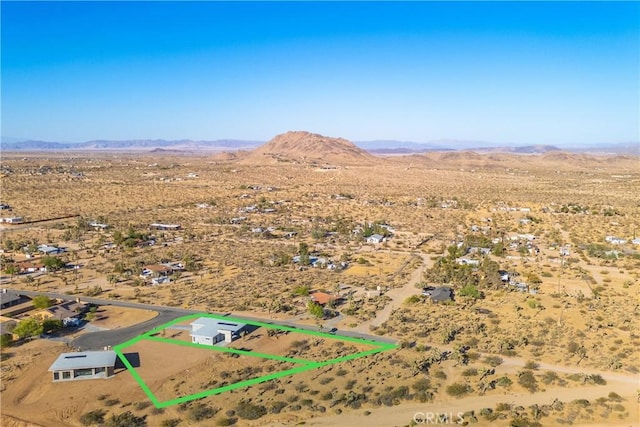 drone / aerial view featuring a mountain view