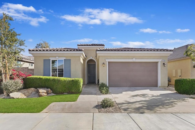 mediterranean / spanish house featuring a garage