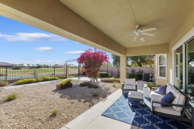 view of patio / terrace featuring an outdoor living space, central AC unit, and ceiling fan