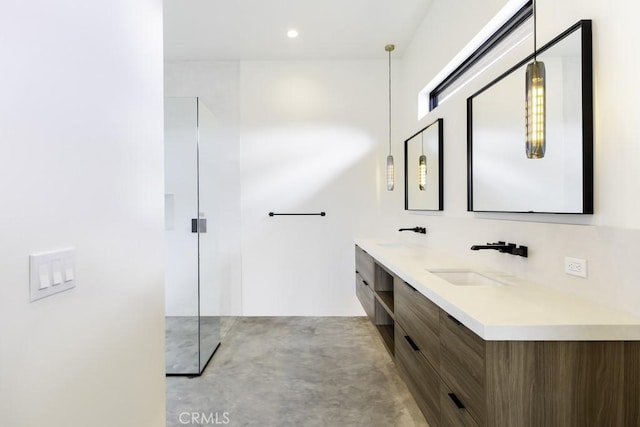 bathroom with concrete floors and vanity