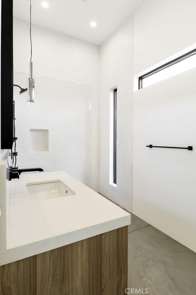 bathroom with concrete flooring