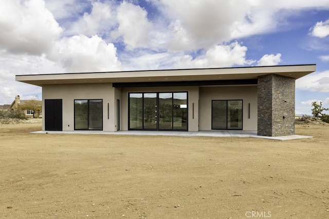 back of property featuring a patio area