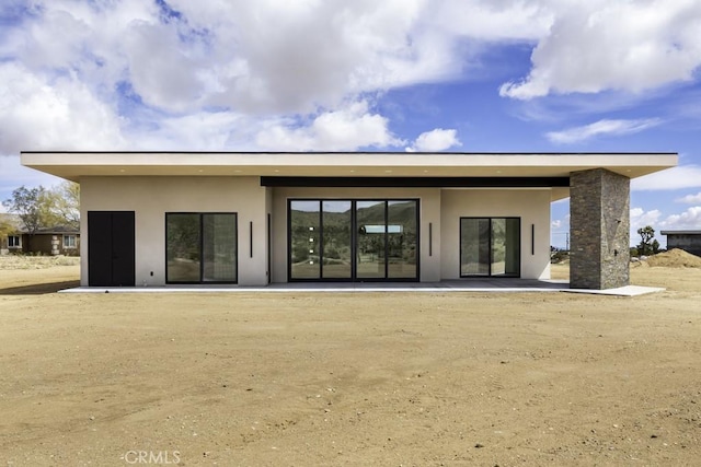 rear view of house with a patio