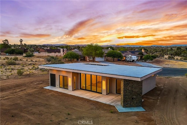 exterior space with a patio area and a mountain view