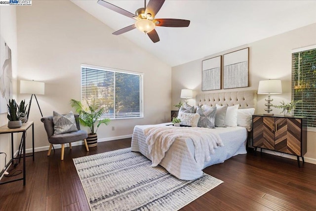 bedroom with dark wood-type flooring, ceiling fan, and high vaulted ceiling