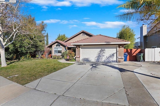 view of front of house featuring a garage and a front lawn