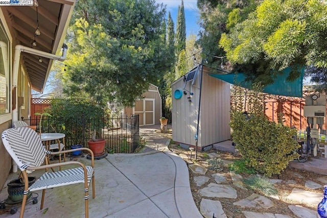 view of patio / terrace with a shed