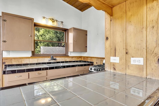 bathroom featuring wooden ceiling, sink, and lofted ceiling with beams