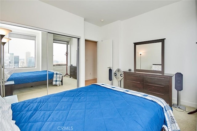 carpeted bedroom featuring a closet