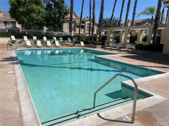 view of swimming pool with a patio area