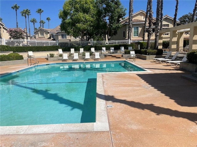 view of swimming pool with a patio area