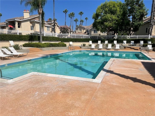 view of swimming pool featuring a patio