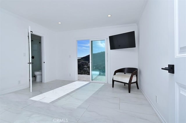 interior space with marble finish floor, crown molding, and baseboards