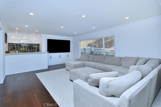 living room featuring recessed lighting, dark wood finished floors, and crown molding