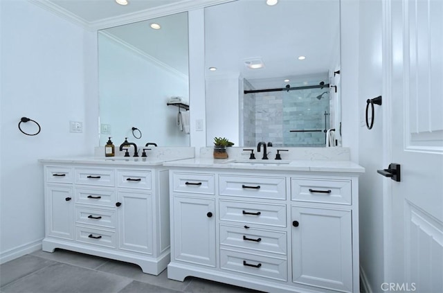 bathroom with double vanity, a stall shower, crown molding, and a sink