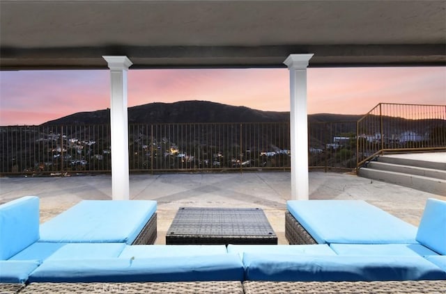 patio terrace at dusk with an outdoor hangout area