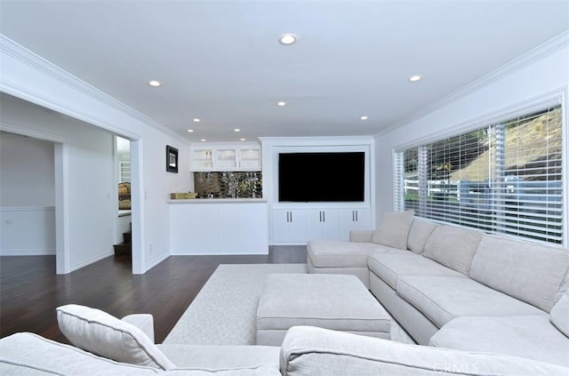 living room featuring baseboards, dark wood-style flooring, crown molding, and recessed lighting