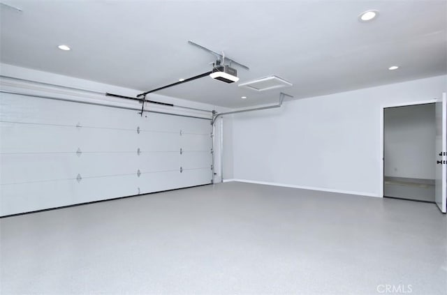 garage with baseboards, recessed lighting, and a garage door opener