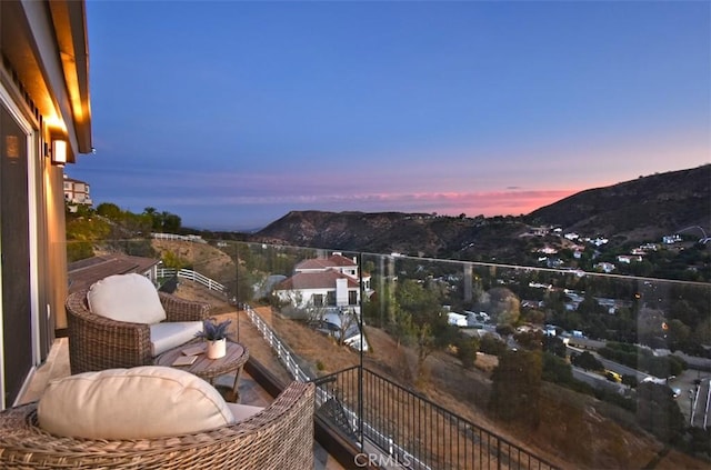 balcony at dusk with a mountain view