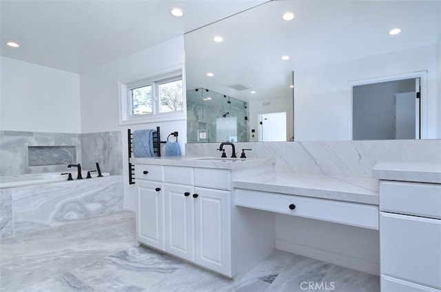 bathroom featuring vanity and an enclosed shower