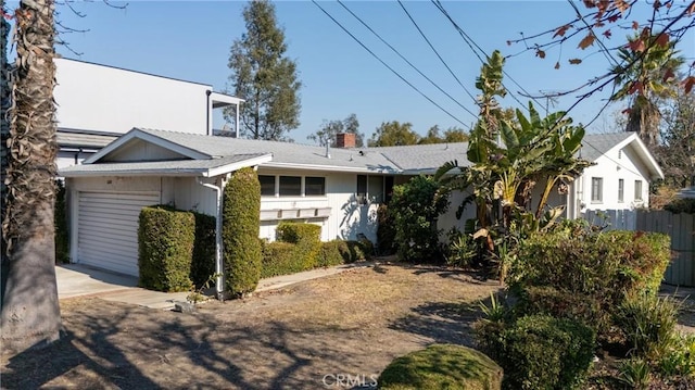 view of side of home featuring a garage