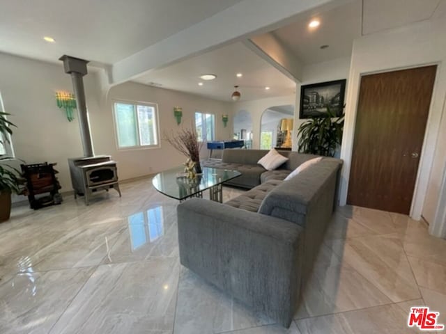 living room featuring beam ceiling