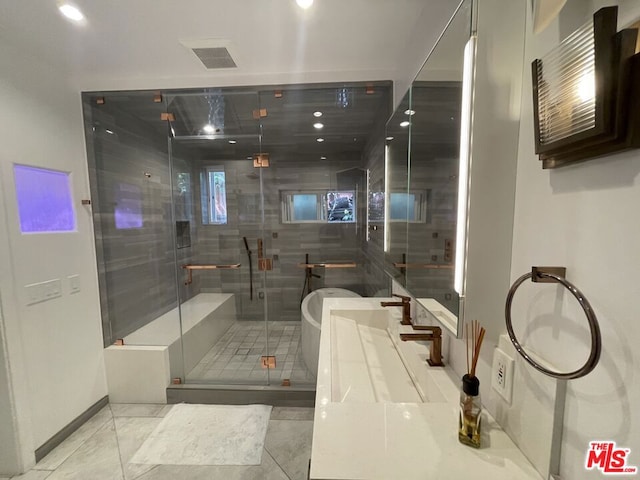 bathroom with tile patterned floors, vanity, and independent shower and bath