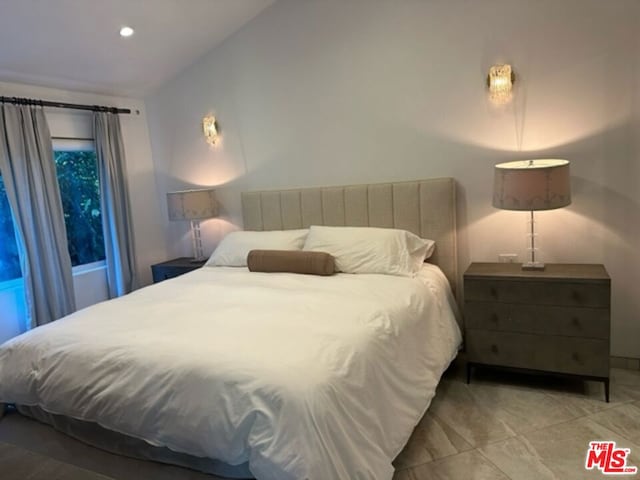 bedroom with lofted ceiling