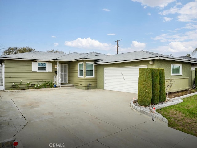 single story home featuring a garage